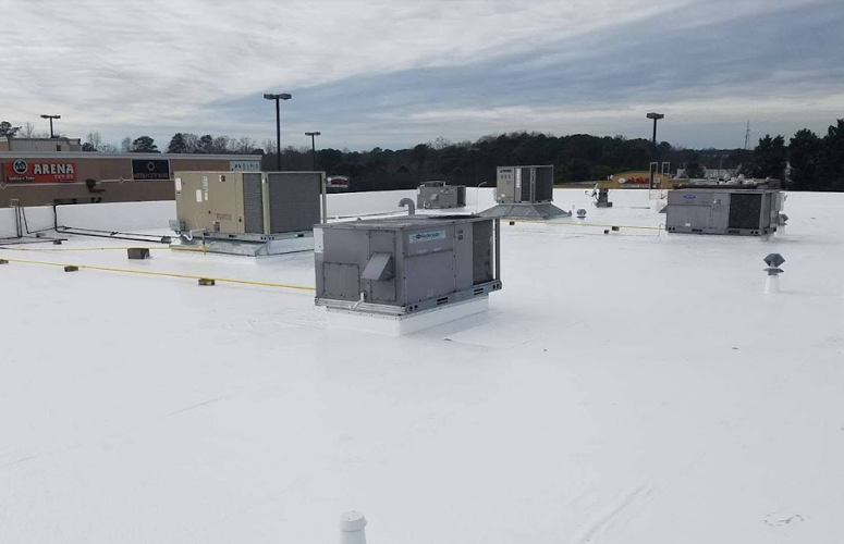 Durable white TPO commercial roofing installation providing energy efficiency and weather resistance for businesses and commercial buildings.
