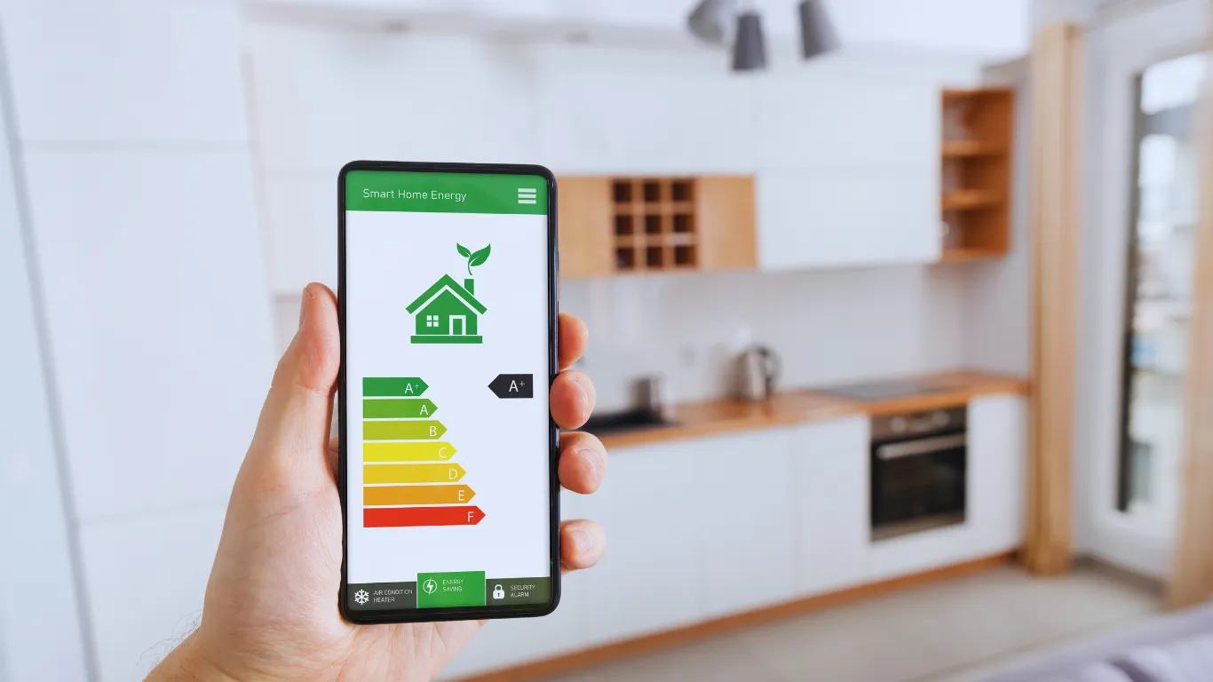 Smart home energy efficiency app displayed on smartphone, highlighting benefits of roof inspections for improved energy savings and home performance.